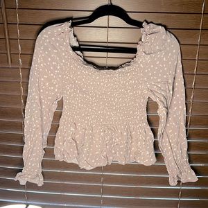 ivory brown with a tint of purple color, needs to be ironed